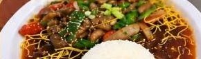 Mongolian beef in a dark sauce over rice
