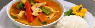 Red coconut curry with peppers and vegetables, rice on the side